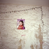 RUSSIA / St.Petersburg / July 2007 / A self-made magazine cover depicting migrant worker Misha's daughter. The poster hangs on the wall in Misha's communal room. Relatively cheap accommodation in communal housing allows Misha and other migrant workers to support their families back home.   

© Max Sher / Anzenberger