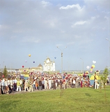 RUSSIA / Magnitogorsk / July 2008 / A funfair on the occasion of the Metal-Makers' Day, a popular local holiday. A Russian Orthodox cathedral is in the background.     

© Max Sher / Anzenberger