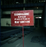 RUSSIA / Magnitogorsk / July 2008 / A safety sign that reads as Beware of the Crane with Magnet! Do Not Walk Here! Danger!

© Max Sher / Anzenberger