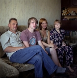 RUSSIA / Magnitogorsk / July 2008 / The Pavlov family, from left to right: Viktor, son Dmitry, daughter Tatyana, wife Olga. Viktor, Dmitry, both rollermen, and Tatyana, a lab assistant, are working at the steel mill. Viktor's father was also a steelmaker for MMK, his brother works at the mill as well.  

© Max Sher / Anzenberger