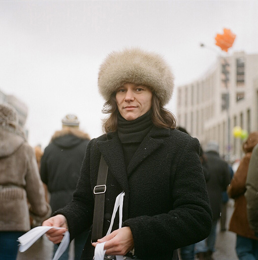 Anya, an activist with the NGO Citizen Observer, handing out white ribbons - the symbol of current protests, to which prime minister Putin infamously referred to as 'condoms'